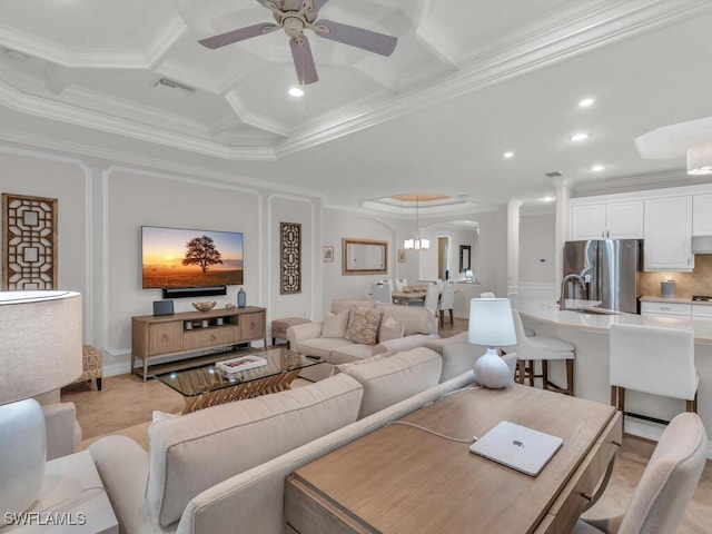 living room with beam ceiling, ornamental molding, coffered ceiling, and ceiling fan