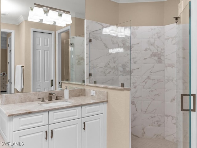 bathroom with vanity, ornamental molding, and walk in shower