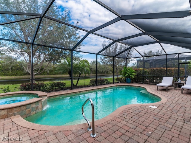 view of swimming pool featuring an in ground hot tub, a patio area, and glass enclosure