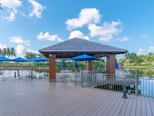 view of dock featuring a gazebo and a deck with water view