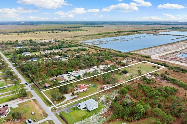 bird's eye view with a rural view and a water view