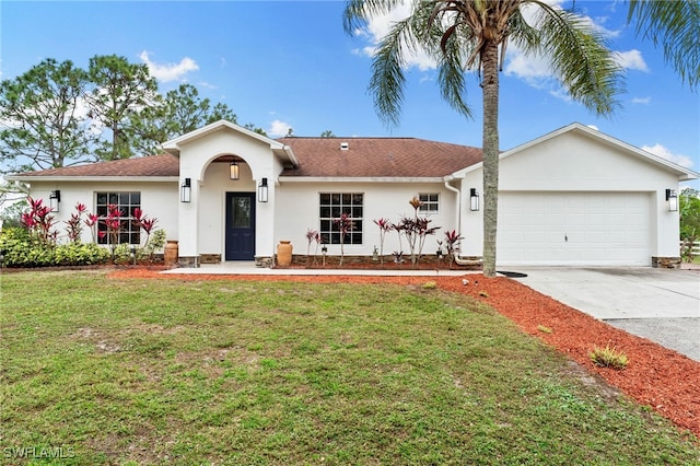 ranch-style house featuring a front yard and a garage