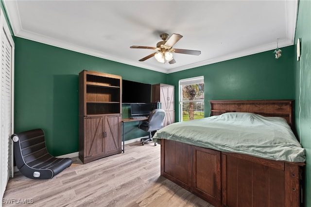 bedroom with light hardwood / wood-style floors, ceiling fan, and ornamental molding