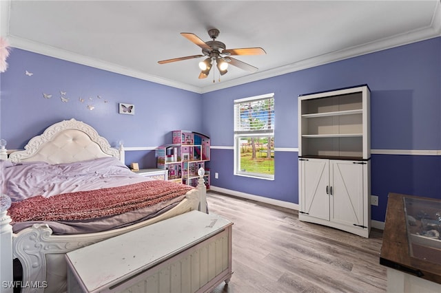 bedroom with light wood-type flooring, ceiling fan, and ornamental molding