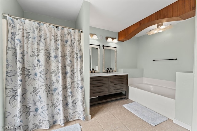 bathroom with vanity, tile patterned floors, and a bathing tub