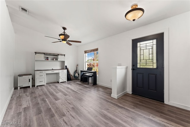 foyer entrance featuring ceiling fan and light hardwood / wood-style floors