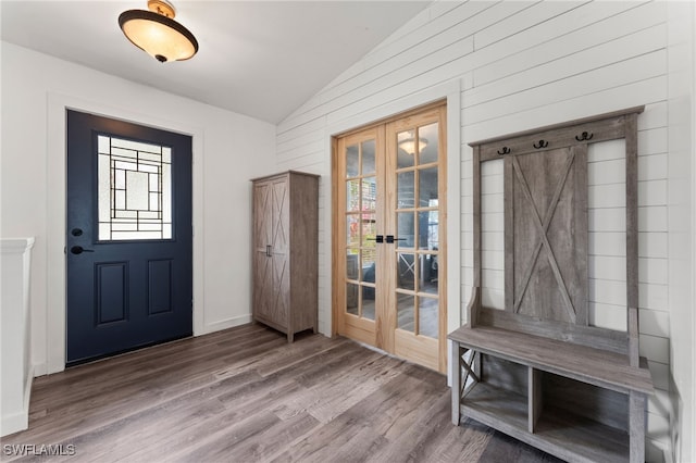 mudroom featuring hardwood / wood-style floors, vaulted ceiling, and french doors