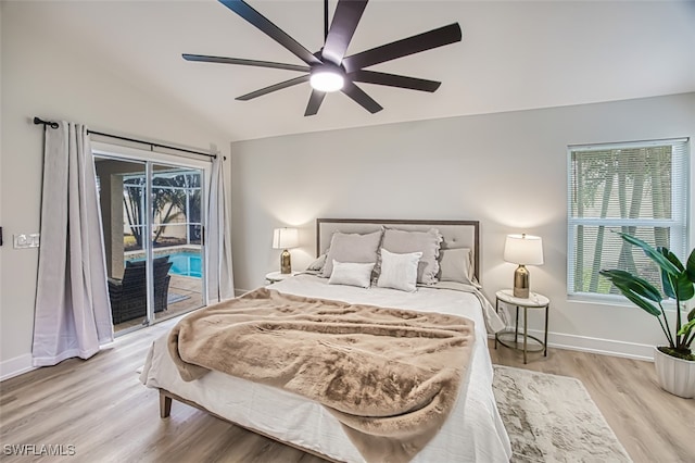 bedroom with light wood-type flooring, ceiling fan, access to exterior, and lofted ceiling