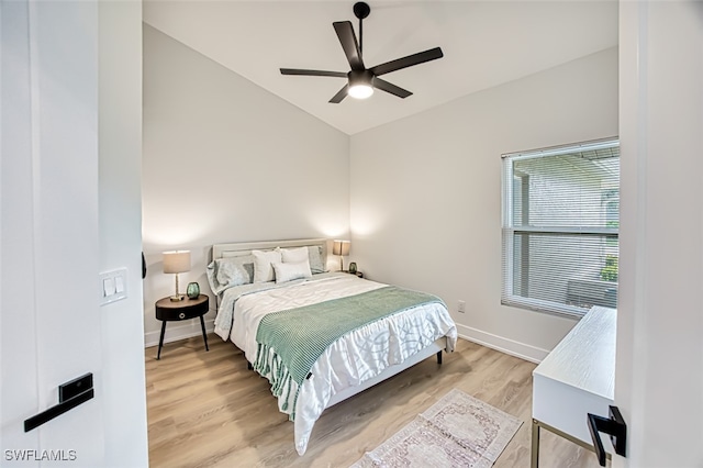 bedroom featuring vaulted ceiling, ceiling fan, and hardwood / wood-style floors