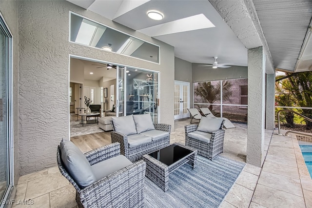 view of patio / terrace featuring an outdoor hangout area, ceiling fan, and french doors