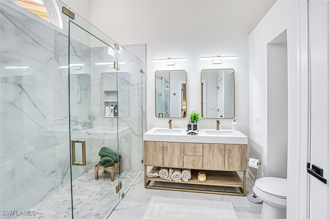 bathroom featuring toilet, walk in shower, and vanity