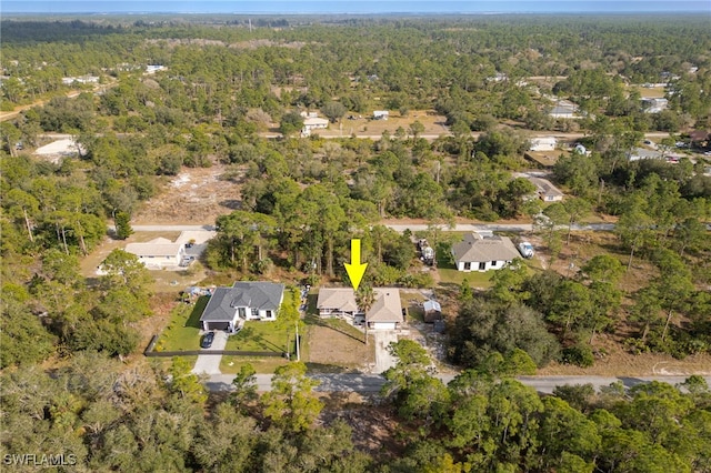 aerial view featuring a residential view and a view of trees