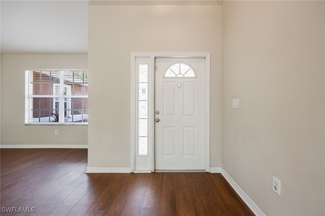 foyer with dark hardwood / wood-style flooring