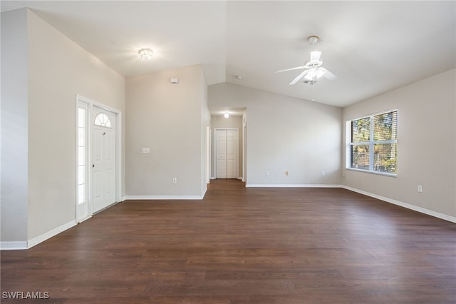 entrance foyer with a ceiling fan, baseboards, vaulted ceiling, and dark wood-type flooring