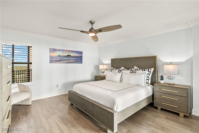 bedroom featuring ceiling fan, light hardwood / wood-style floors, and ornamental molding