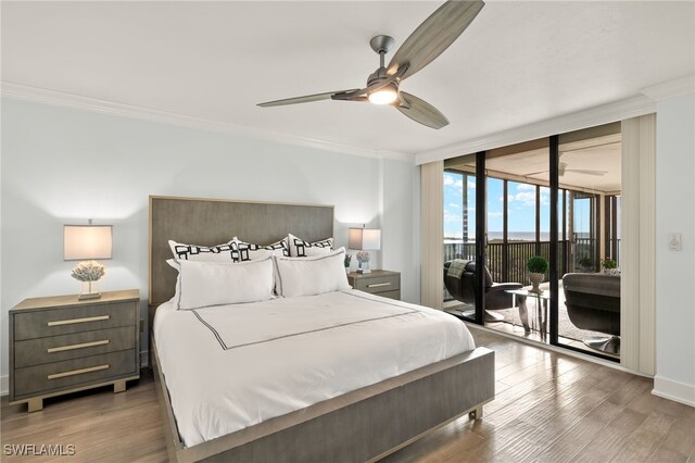 bedroom featuring access to outside, a wall of windows, crown molding, dark hardwood / wood-style flooring, and ceiling fan