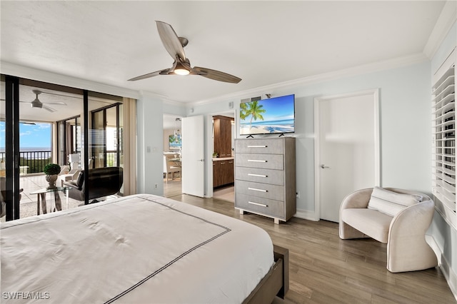bedroom with wood finished floors, access to outside, ornamental molding, baseboards, and a ceiling fan