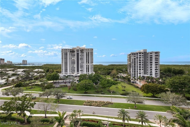 aerial view featuring a view of city and a water view