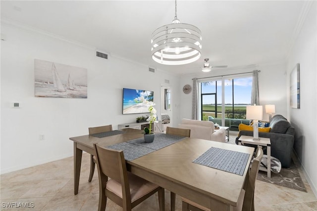 dining space featuring ceiling fan with notable chandelier and crown molding