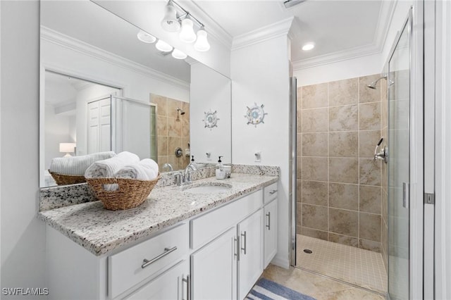 bathroom featuring a shower with shower door, tile patterned floors, vanity, and ornamental molding