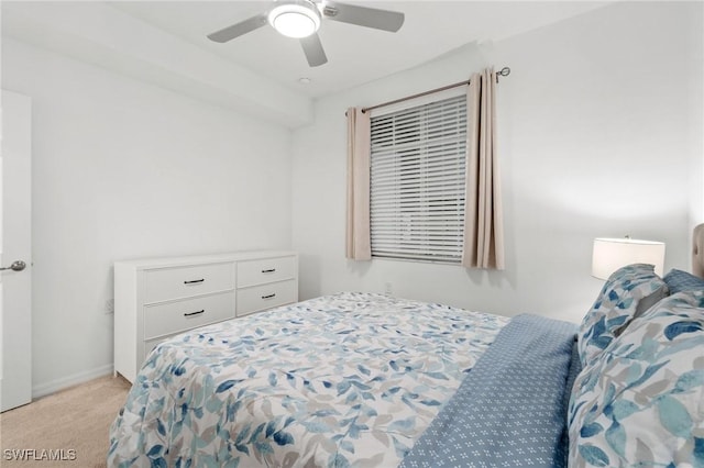 bedroom featuring ceiling fan and light colored carpet