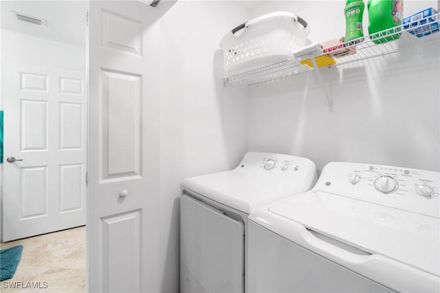 laundry room with washing machine and dryer