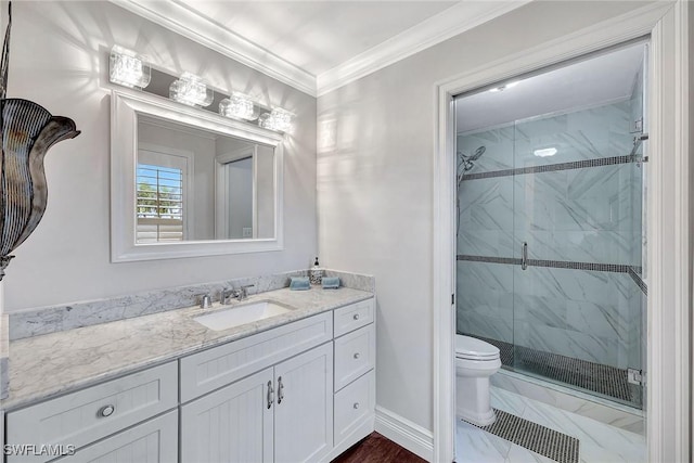 bathroom featuring ornamental molding, toilet, a shower with door, and vanity