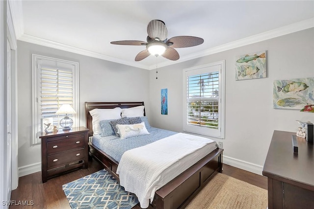 bedroom featuring dark hardwood / wood-style flooring, crown molding, and ceiling fan