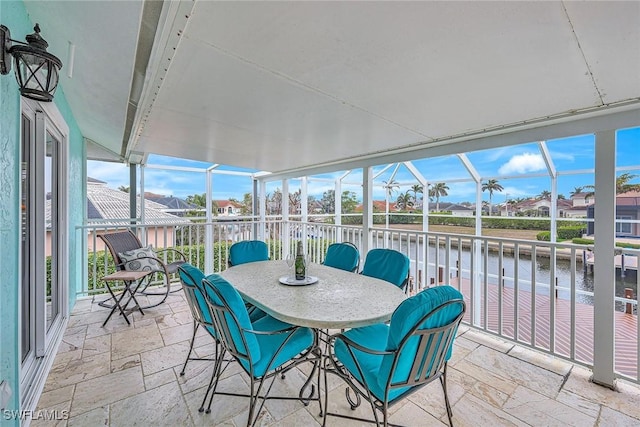 sunroom with a water view