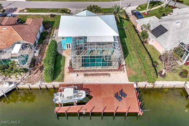 birds eye view of property with a water view