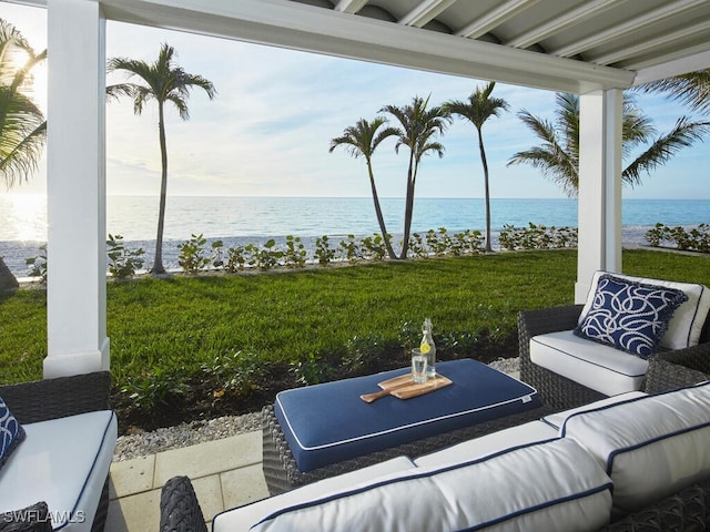 view of patio / terrace with a water view and an outdoor living space