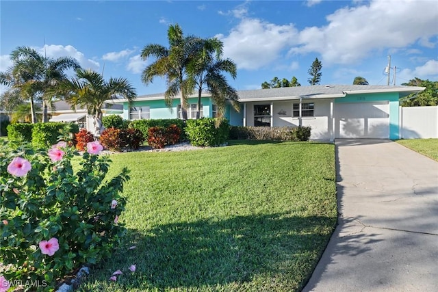 single story home with a garage and a front lawn