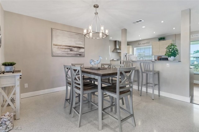 dining area featuring a notable chandelier