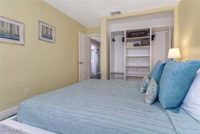 bedroom with a walk in closet