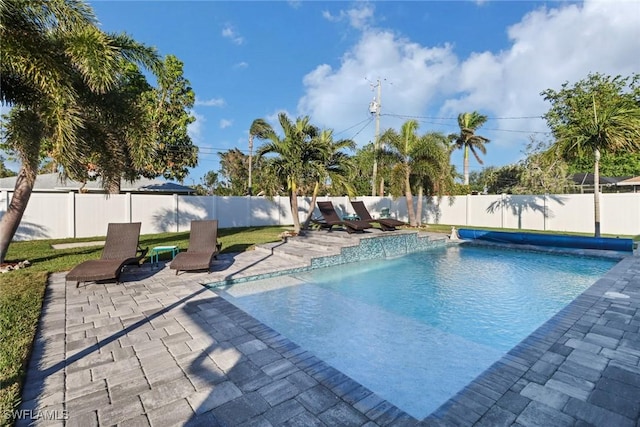 view of pool with pool water feature and a patio area