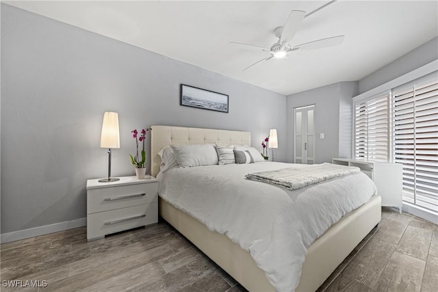 25850 Hickory Blvd Unit A-104, Bonita Springs, FL 34134 - bedroom with wood finished floors, ceiling fan, and baseboards