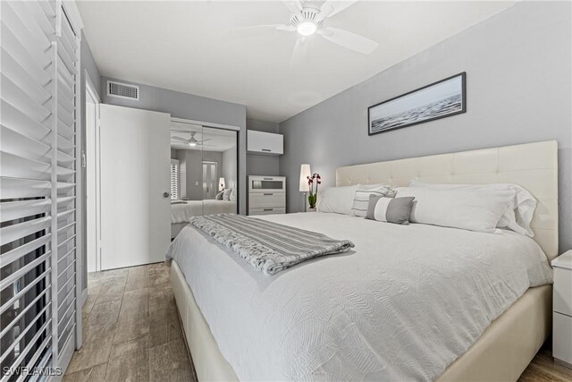 25850 Hickory Blvd Unit A-104, Bonita Springs, FL 34134 - bedroom with wood finished floors and a ceiling fan