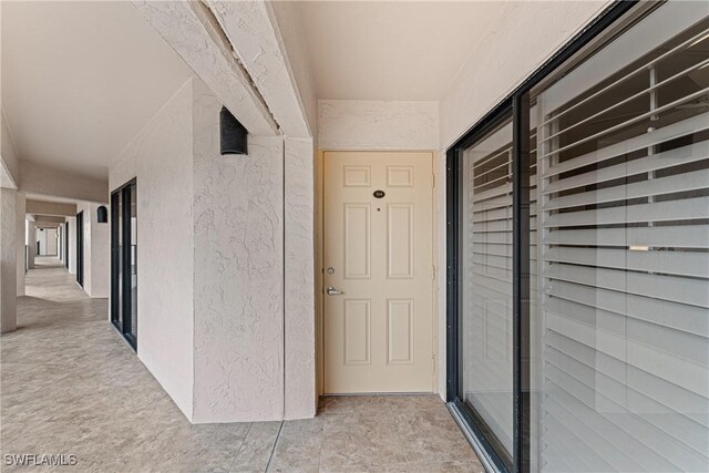 25850 Hickory Blvd Unit A-104, Bonita Springs, FL 34134 - view of exterior entry with stucco siding