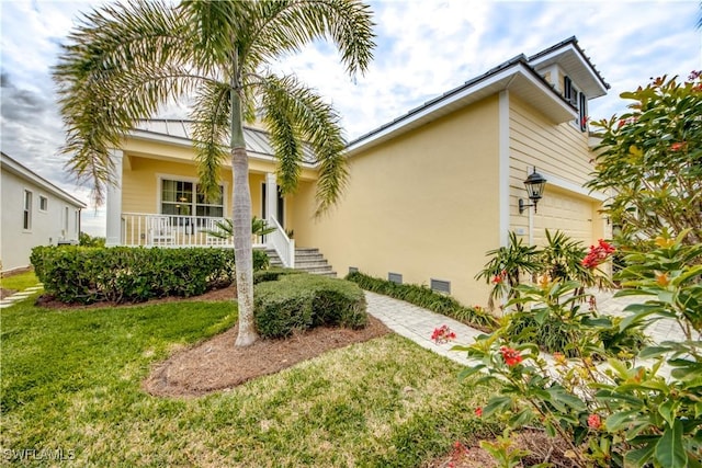 view of front facade featuring a front lawn and a garage