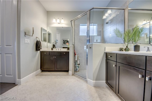 bathroom featuring tile patterned floors, walk in shower, and vanity