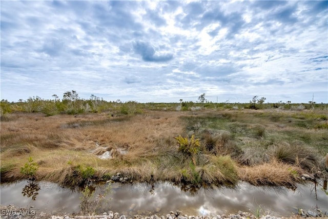 view of landscape with a water view