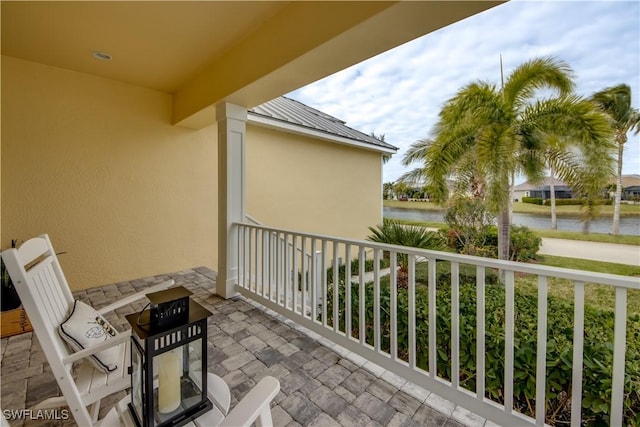 balcony featuring a water view