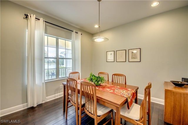 dining space with dark hardwood / wood-style floors