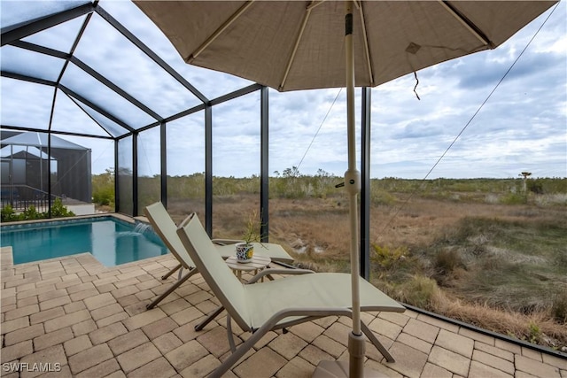 view of pool with a lanai and a patio