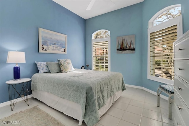 tiled bedroom with ceiling fan