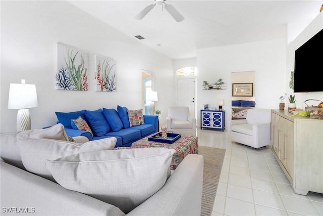 tiled living room featuring ceiling fan