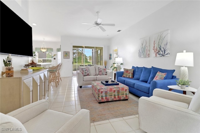 living room featuring ceiling fan and light tile patterned flooring