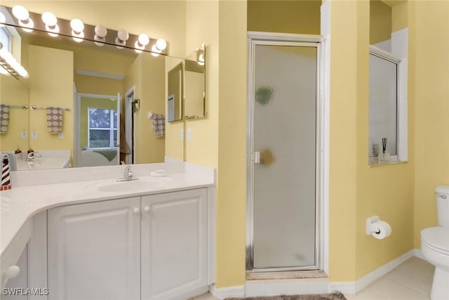 bathroom featuring toilet, walk in shower, vanity, and tile patterned flooring