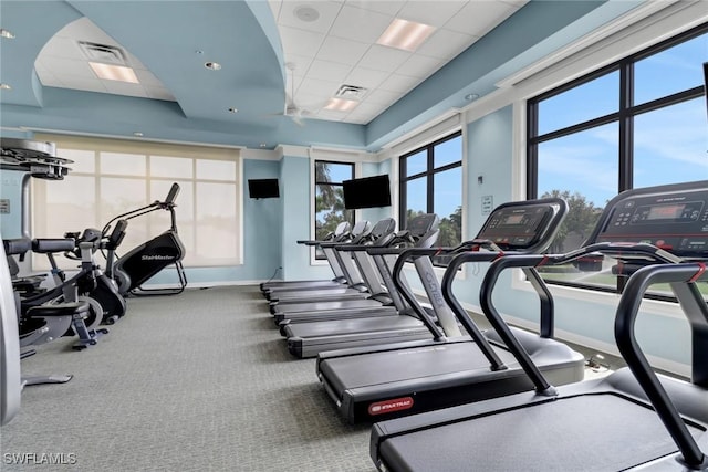 exercise room with a paneled ceiling