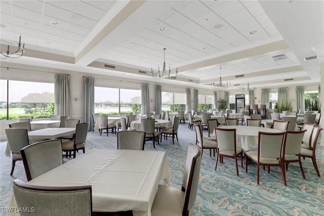 dining room with beam ceiling, light carpet, a chandelier, and wooden ceiling